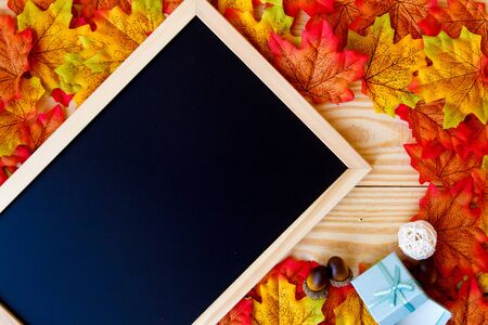 maple leaf and blackboard for text with black background.