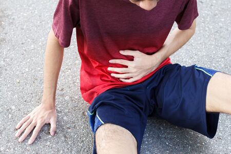 the runner man side cramps after running. workout conceptの写真素材