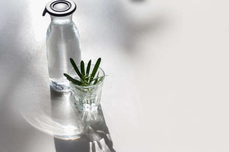 The Glass of water with a bottle on tableの写真素材