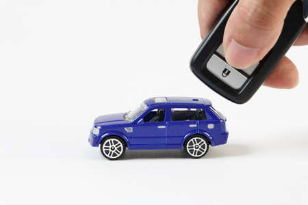Concept for car and security , The toy blue car and key for security.