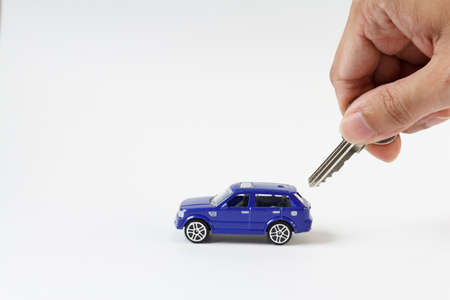 Concept for car and security , The toy blue car and key for security.の写真素材