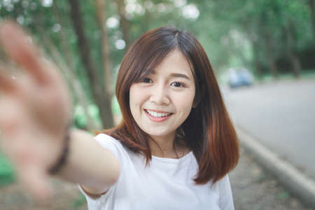 Happy woman check hand to front camera.の写真素材