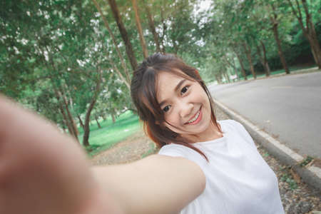 Happy woman check hand to front camera.の写真素材
