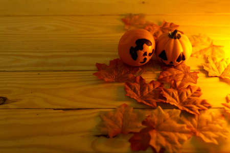 Halloween pumpkins with painted faces on a wooden table. Halloween background. Space for text. copy space. Halloween conceptの写真素材