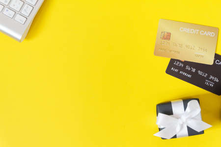 Mock-up online sales day with yellow paper backgroundの写真素材