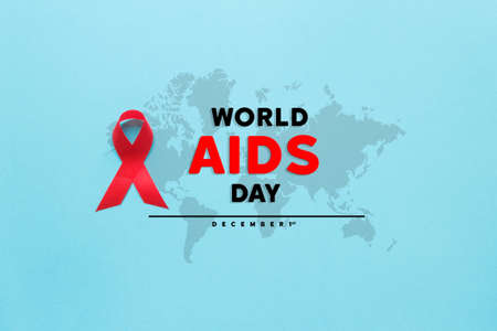 red AIDS awareness ribbon on the blue paper background. World aids day and healthcare and medicine conceptの写真素材