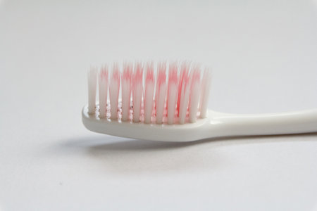 Close up old toothbrush isolated on white backgroundの写真素材