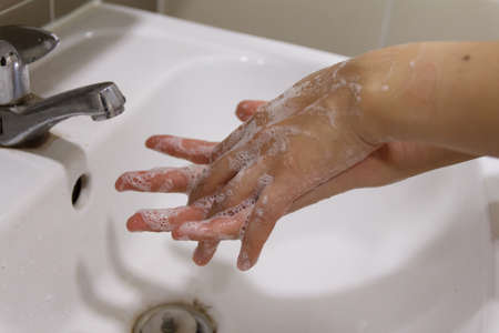 Washing hands rubbing with soap for virus prevention. Health careの写真素材