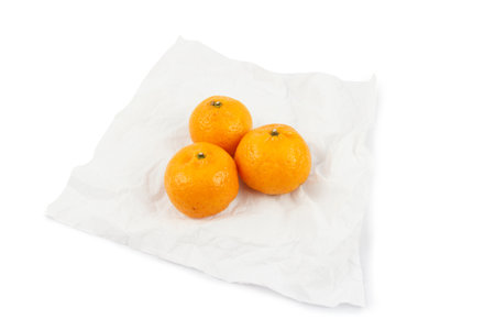 tangerine orange on tissue paper isolate white background.の写真素材