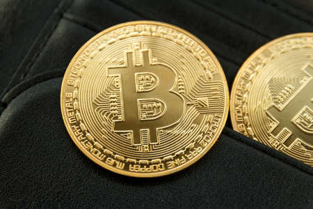 bitcoin is place on the wallet, cryptocurrency trading technology concept.の写真素材