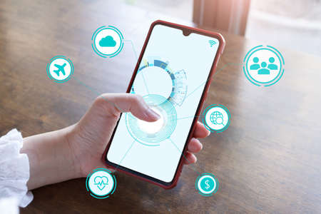 IoT Internet of Things development concept ,The hand touch screen smartphone to show the concept of...