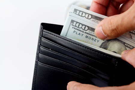 mock up cash in wallet. Close up Hand man get his money from wallet.の写真素材