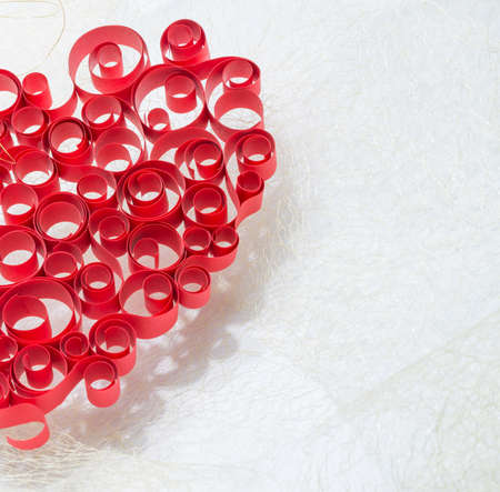   curled Red heart isolated on white backgroundの写真素材