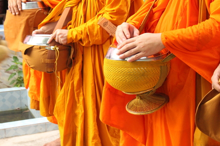 Peoples offer food to the monksの写真素材