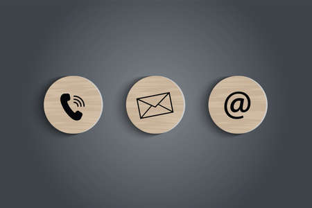 E-mail address ,telephone number and letter icons print screen on circle wooden block on table for...