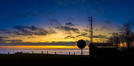 Amazing sunset sunrise inversion night view of the transmitter with lookout on the top mountain Kozakov. Czech Republic. The best photoの写真素材
