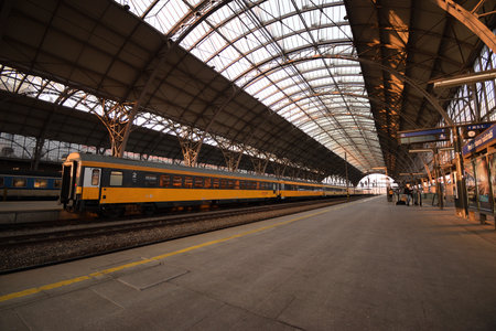 Prague, Czechia - February 27, 2022: orange train of Regiojet company in main train station of Pragueのeditorial素材