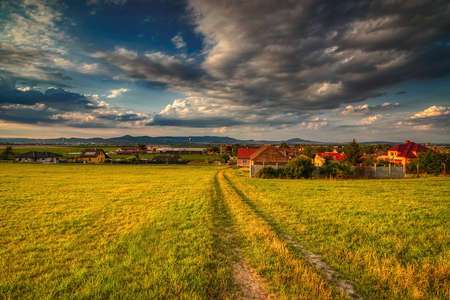 village at summer sunsetの写真素材
