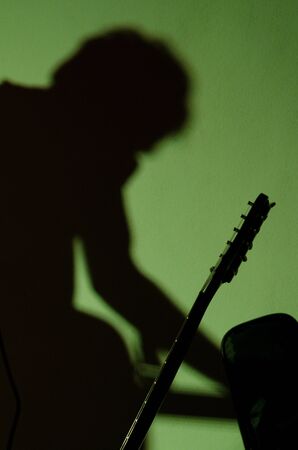 Shadow of the guitarist at the concertの写真素材