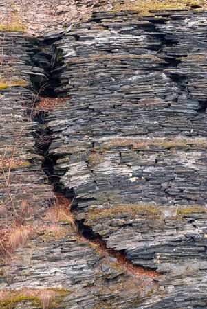 Ancient slate wall with huge crackの写真素材