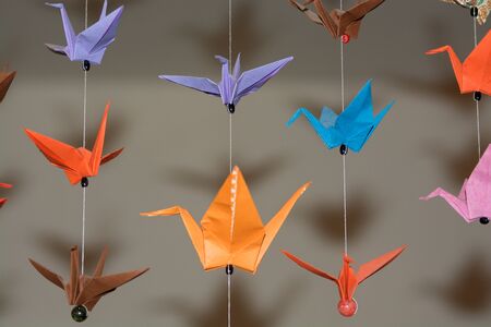 origami crane birds made from colour papersの写真素材