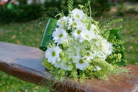wedding bouquet of white chrysanthemum and meadow flowersの写真素材