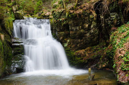Waterfall in a rocky canyonの写真素材