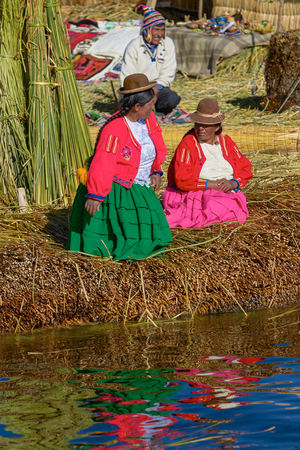 Family Living at Floating Islands of Uros at Lake Titicaca in Peru and Boliviaの写真素材