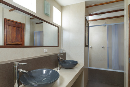 Bathroom with Cream Tiled Walls.の写真素材