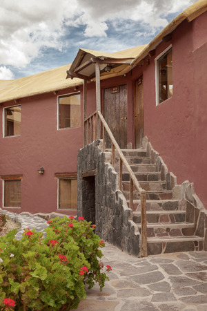 CHIVAY, AREQUIPA, PERU - NOVEMBER 25, 2015: A traditional vintage hotel in Chivay, Arequipa Peru with clouds.のeditorial素材