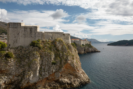 Ancient fortress on the cliff edge of Dubrovnik protects the port.の写真素材