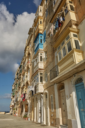 VALLETTA, MALTA - OCTOBER 30, 2017: Traditional colorful architecture and houses with balconies in Valletta in Malta.のeditorial素材