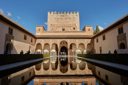 People visiting courtyard of the Myrtles (Patio de los Arrayanes) in La Alhambra, Granada, Spain.のeditorial素材