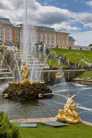 People visiting famous landmark of Peterhof, close to city of St. Petersburg in Russia and enjoying sunny summer day.のeditorial素材