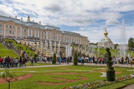 People visiting famous landmark of Peterhof, close to city of St. Petersburg in Russia and enjoying sunny summer day.のeditorial素材