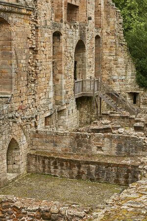 DUNFERMLINE, SCOTLAND - AUGUST 02, 2017: Medieval Romanesque monastery and Benedictine cemetery in the Scottish town of Dunfermline in Fifeのeditorial素材