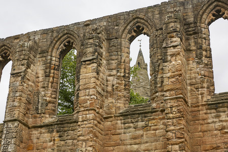 DUNFERMLINE, SCOTLAND - AUGUST 02, 2017: Medieval Romanesque monastery and Benedictine cemetery in the Scottish town of Dunfermline in Fifeのeditorial素材