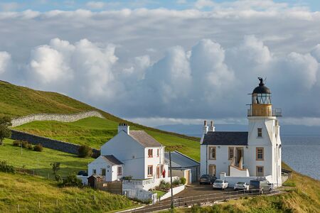 SCRABSTER, SCOTLAND, UK - AUGUST 08, 2017: Lighthouse at Holborn Head - disused lighthouse and accomodation in Scrabster, the north of Scotlandのeditorial素材