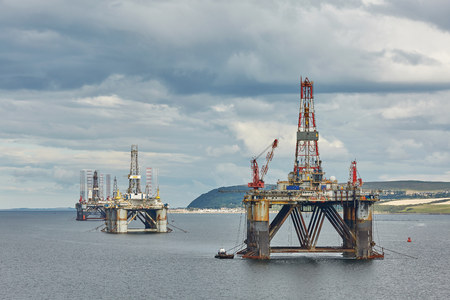 INVERGORDON, UK - AUGUST 07: Large offshore oil rig drilling platforms off the coastline near Invergordon in Scotlandのeditorial素材