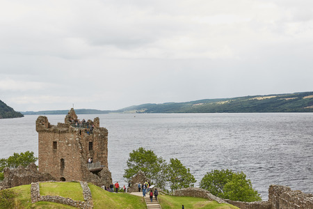 INVERNESS, SCOTLAND - AUGUST 07, 2017: People enjoying vist at Urquhart Castle on the Shore of Loch Ness, Scotlandのeditorial素材