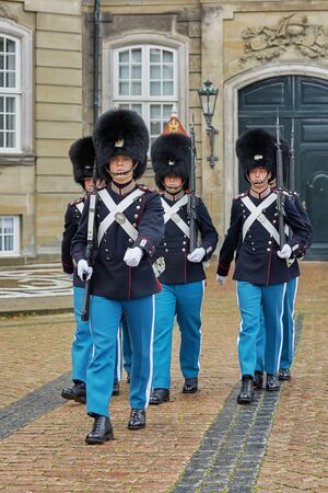 COPENHAGEN, DENMARK - SEPTEMBER 16, 2017: The guards of honour march along the square near the Royal residence Amalienborg Palace in Copenhagen.のeditorial素材
