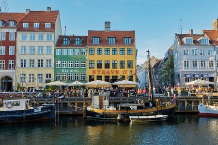 COPENHAGEN, DENMARK - MAY 25, 2017: Colourful facades and restaurants on Nyhavn embankment and old ships along the Nyhavn Canal in Copenhagen, Denmarkのeditorial素材