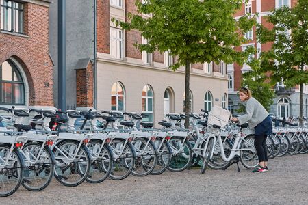 COPENHAGEN, DENMARK - MAY 25, 2017: Bicycle rental on the street in the city center. Bike is a popular way of transport in the city of Copenhagen in Denmark.のeditorial素材
