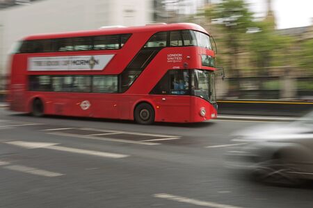 LONDON, UK - SEPTEMBER 08, 2017: Blurred movement of iconic old red double decker through the streets of London in UK.のeditorial素材