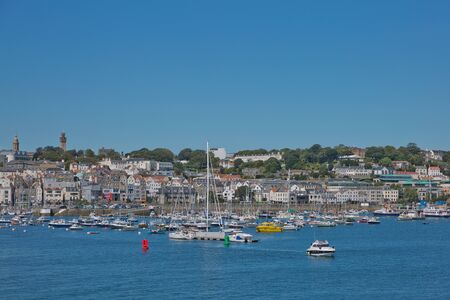 ST. PETER PORT, GUERNSEY, UK - AUGUST 16, 2017: Scenic view of a bay in St. Peter Port in Guernsey, Channel Islands, UK.のeditorial素材