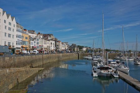 ST. PETER PORT, GUERNSEY, UK - AUGUST 16, 2017: Scenic view of a bay in St. Peter Port in Guernsey,...