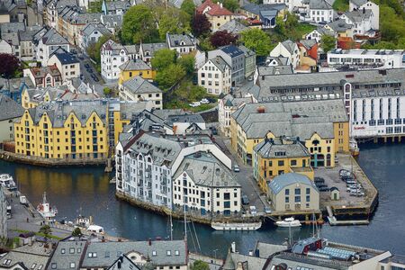 ALESUND, NORWAY - MAY 29, 2017: View of central city part with historic art nouveau architectural style in which most of the town was rebuilt after a fire in 1904. Scandinavia, Europe.のeditorial素材