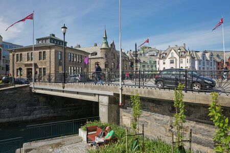 ALESUND, NORWAY - MAY 29, 2017: People enjoying the city life during sunny summer day in Alesund in Norway.のeditorial素材