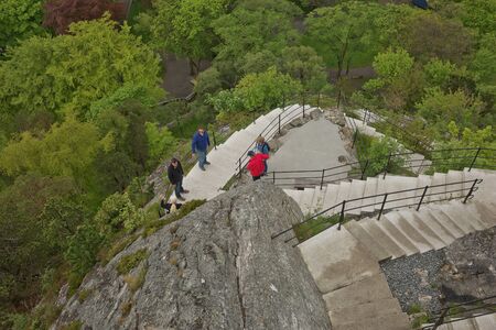 ALESUND, NORWAY - MAY 29, 2017: People climbing the stairs to Fjellstua in Alesund in Norway.のeditorial素材