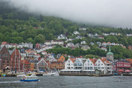 Old hansaetic wooden houses built in row at wharf of Bergen fjord are UNESCO World Heritage site and very popular for turistsのeditorial素材